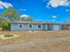 Charming single-story home featuring a one-car garage, complemented by a lush green lawn and garden at 2802 English Dr, Deltona, FL 32738