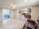 Open-concept living area with seamless flow to the dining room and outdoor space at 2802 English Dr, Deltona, FL 32738
