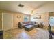 Inviting living room featuring tiled floors, a comfortable sectional couch, and plenty of natural light at 2802 English Dr, Deltona, FL 32738