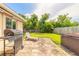 Spacious backyard featuring a built-in grill and patio, ideal for outdoor living at 306 Jefferson Ave, Port Orange, FL 32127