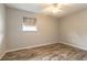 Neutral bedroom featuring wood floors, a ceiling fan, and a window at 306 Jefferson Ave, Port Orange, FL 32127
