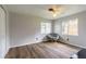 Relaxing bedroom features hardwood flooring and a papasan chair at 306 Jefferson Ave, Port Orange, FL 32127