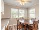 Cozy breakfast nook with wood floors, ceiling fan, and great natural light at 306 Jefferson Ave, Port Orange, FL 32127