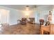 Inviting living room boasts a traditional piano, hardwood-style flooring, and leather furniture at 306 Jefferson Ave, Port Orange, FL 32127