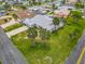 Beautiful overhead view of a well-kept home with a grey roof, green lawn, and mature landscaping at 31 E Sea Harbor, Ormond Beach, FL 32176
