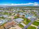 Aerial shot of a quiet residential neighborhood near the Intercoastal waterway, showcasing well-maintained lawns and cozy homes at 31 E Sea Harbor, Ormond Beach, FL 32176
