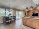 Cozy dining area adjacent to the kitchen with natural light and views of the outdoor pool at 31 E Sea Harbor, Ormond Beach, FL 32176