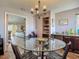 Bright dining room featuring a glass table, unique chairs and a decorative chandelier at 31 E Sea Harbor, Ormond Beach, FL 32176