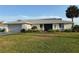 Charming single-story home with a well-maintained lawn, mature landscaping, and a two-car garage at 31 E Sea Harbor, Ormond Beach, FL 32176