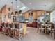 Open-concept kitchen with stainless steel appliances, a breakfast bar, and adjacent dining area at 31 E Sea Harbor, Ormond Beach, FL 32176
