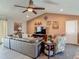 Spacious living room with vaulted ceiling, a large sectional sofa, and nautical decor, perfect for relaxation at 31 E Sea Harbor, Ormond Beach, FL 32176