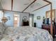 Main bedroom with a four-poster bed, ceiling fan, and decorative accents at 31 E Sea Harbor, Ormond Beach, FL 32176