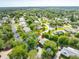 The house has a large, well-maintained yard with mature trees, offering privacy and shade at 315 Sweet Bay Ave, New Smyrna Beach, FL 32168