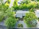 An aerial view of the home highlighting its well-maintained landscaping, circular driveway, and the roof at 315 Sweet Bay Ave, New Smyrna Beach, FL 32168