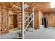 Finished basement includes a spiral staircase, wood paneled walls, and exercise equipment at 315 Sweet Bay Ave, New Smyrna Beach, FL 32168
