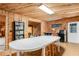 Finished basement featuring wood paneled walls, a craft table, and a mini fridge at 315 Sweet Bay Ave, New Smyrna Beach, FL 32168