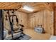 Basement gym area features wood paneled walls and a full body weight machine at 315 Sweet Bay Ave, New Smyrna Beach, FL 32168