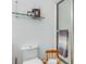 Bathroom showcases a clean toilet, glass shelf with decorations, and a shower stall at 315 Sweet Bay Ave, New Smyrna Beach, FL 32168