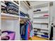 Walk-in closet with custom shelving and organized storage for clothing and accessories at 315 Sweet Bay Ave, New Smyrna Beach, FL 32168