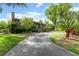 The house showcases a well-manicured lawn with tropical plants and a private front yard at 315 Sweet Bay Ave, New Smyrna Beach, FL 32168