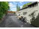 Exterior shows a multi-level house with a two car garage and surrounding trees at 315 Sweet Bay Ave, New Smyrna Beach, FL 32168
