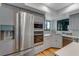 Updated kitchen featuring stainless steel appliances, granite countertops, and custom cabinets at 315 Sweet Bay Ave, New Smyrna Beach, FL 32168