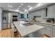 Bright kitchen with a large island, stainless steel appliances, and modern lighting at 315 Sweet Bay Ave, New Smyrna Beach, FL 32168