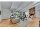 Spacious living room featuring vaulted ceilings, fireplace, and stylish furniture at 315 Sweet Bay Ave, New Smyrna Beach, FL 32168