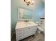 Bathroom featuring vanity sink with mirror, modern fixtures and tub with shower at 3303 Victory Palm Dr, Edgewater, FL 32141