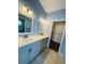 Bathroom featuring a double vanity with modern fixtures and hardware, and tile flooring at 3303 Victory Palm Dr, Edgewater, FL 32141