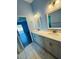 Stylish bathroom featuring dual sinks, modern fixtures, and tile flooring at 3303 Victory Palm Dr, Edgewater, FL 32141