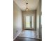 Welcoming foyer featuring decorative tiled flooring, an elegant light fixture, and a beautifully designed front door at 3303 Victory Palm Dr, Edgewater, FL 32141