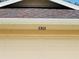 Close-up of the house number '3303' displayed above the garage door, accented by a textured roof at 3303 Victory Palm Dr, Edgewater, FL 32141
