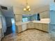Bright kitchen featuring granite countertops, neutral cabinets, and modern appliances at 3303 Victory Palm Dr, Edgewater, FL 32141