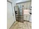 Modern kitchen featuring stainless steel appliances, granite countertops, and ample cabinet space for storage at 3303 Victory Palm Dr, Edgewater, FL 32141