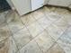 Tan, square-tiled floor featuring various natural patterns inside of a modern kitchen at 3303 Victory Palm Dr, Edgewater, FL 32141