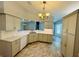 Well-appointed kitchen with modern countertops, cabinetry and a functional layout that opens to the living area at 3303 Victory Palm Dr, Edgewater, FL 32141
