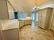 Bright kitchen featuring granite countertops, neutral cabinets, and modern appliances at 3303 Victory Palm Dr, Edgewater, FL 32141