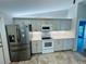 A complete kitchen with stainless steel appliances and modern tiling, topped with overhead lighting at 3303 Victory Palm Dr, Edgewater, FL 32141