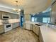 Updated kitchen featuring granite countertops, white cabinetry, and modern appliances for a seamless cooking experience at 3303 Victory Palm Dr, Edgewater, FL 32141