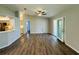Spacious living room with neutral walls, stylish flooring, and a smooth transition to the kitchen and outdoor areas at 3303 Victory Palm Dr, Edgewater, FL 32141