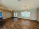 Open living room area featuring hardwood floors, ceiling fan and natural light at 3303 Victory Palm Dr, Edgewater, FL 32141