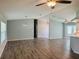 Spacious living room featuring hardwood floors, ceiling fans, and neutral paint at 3303 Victory Palm Dr, Edgewater, FL 32141