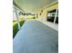 This covered patio has a concrete floor, a view of the backyard and a exterior light at 3303 Victory Palm Dr, Edgewater, FL 32141