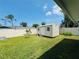 Backyard view of a storage shed and fence line at 3303 Victory Palm Dr, Edgewater, FL 32141
