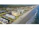 Aerial view of beachfront condos with a pool and easy beach access at 3509 S Atlantic Ave # 102 And 103, New Smyrna Beach, FL 32169