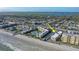 Aerial view of the beachfront condo complex with pool, beach access, and coastal charm at 3509 S Atlantic Ave # 102 And 103, New Smyrna Beach, FL 32169