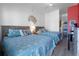 Comfortable bedroom offers two beds, beachy decor, and ample natural light at 3509 S Atlantic Ave # 102 And 103, New Smyrna Beach, FL 32169