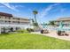 Well-maintained common area with grilling stations and picnic tables alongside a sparkling pool at 3509 S Atlantic Ave # 102 And 103, New Smyrna Beach, FL 32169