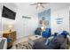 Inviting living room with a coastal-themed design, comfortable seating, and a flat-screen TV for entertainment at 3509 S Atlantic Ave # 102 And 103, New Smyrna Beach, FL 32169